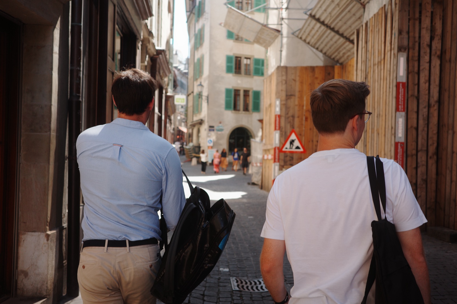 Two of us walking down a narrow lane in Geneva.