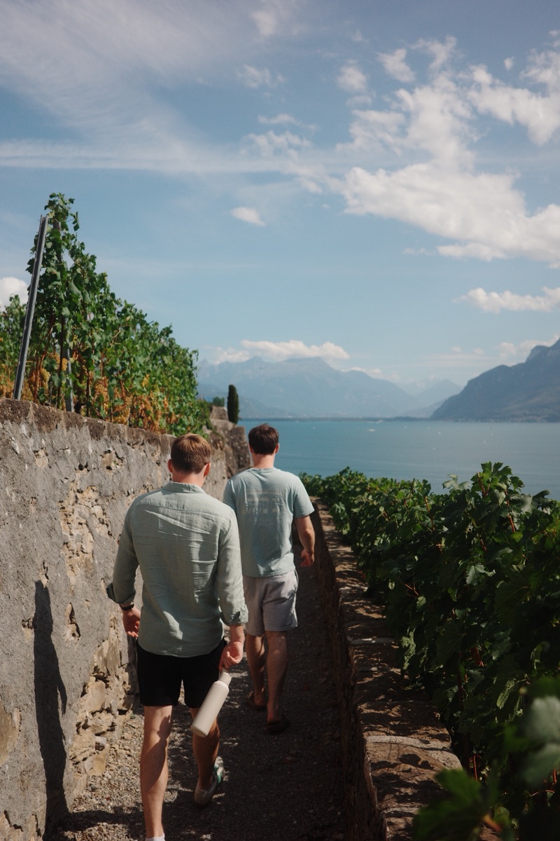 Two of us walking a path through the vineyards towards the lake.