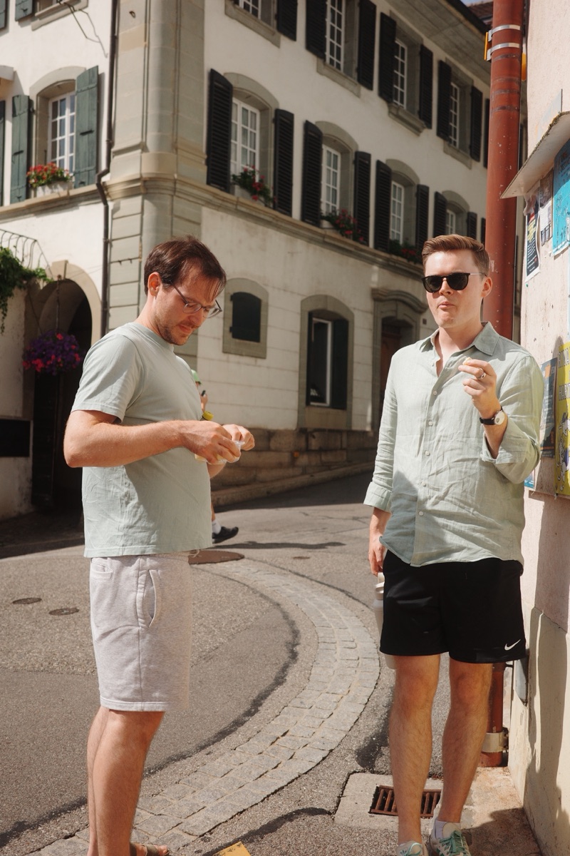 Two of us talking in a sunny street.